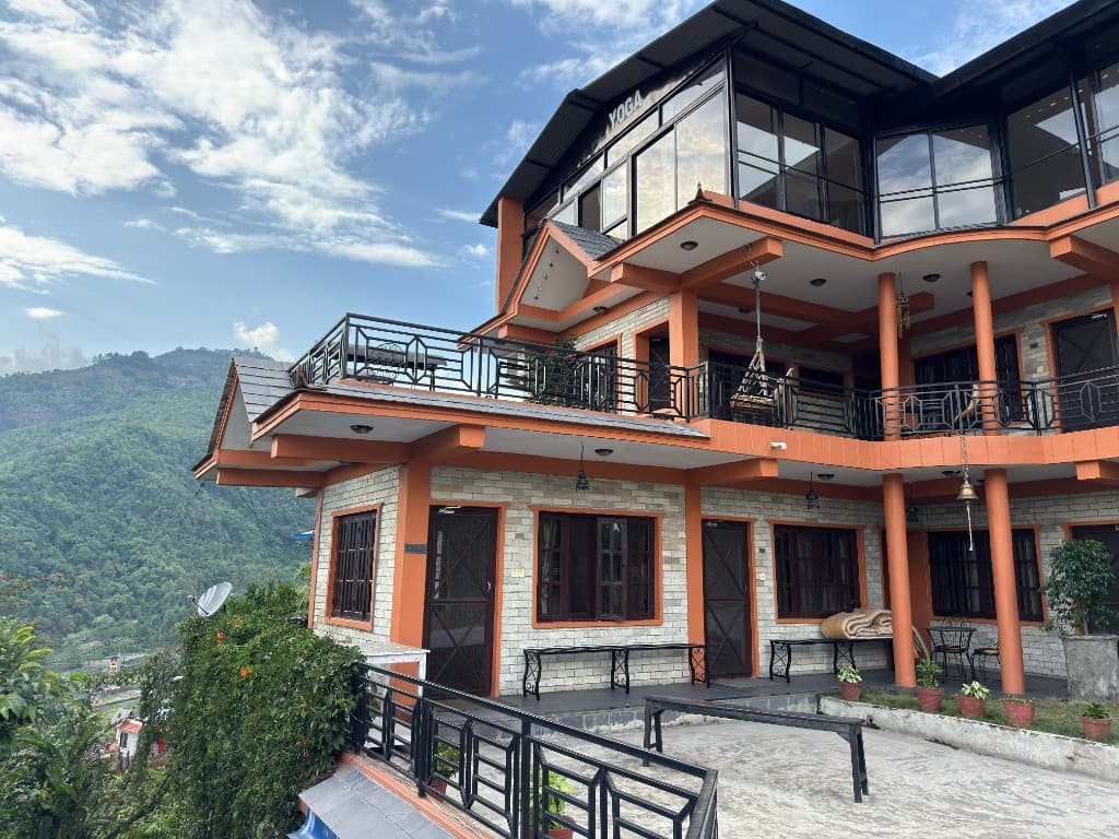 Yogaban Retreat exterior with panoramic yoga studio and Himalayan mountain views