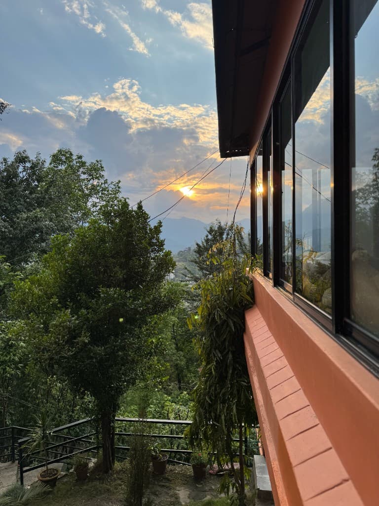 Golden sunset over the Himalayan valley from Yogaban Retreat Pokhara