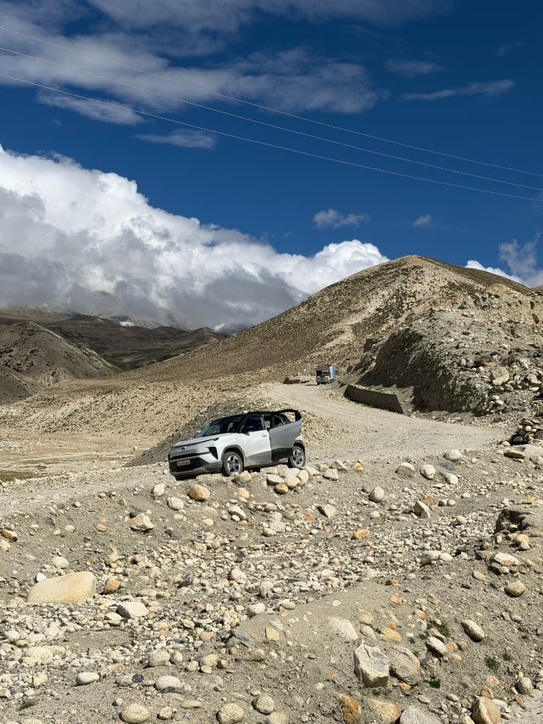 Punch EV climbing a rocky dirt track toward Korala