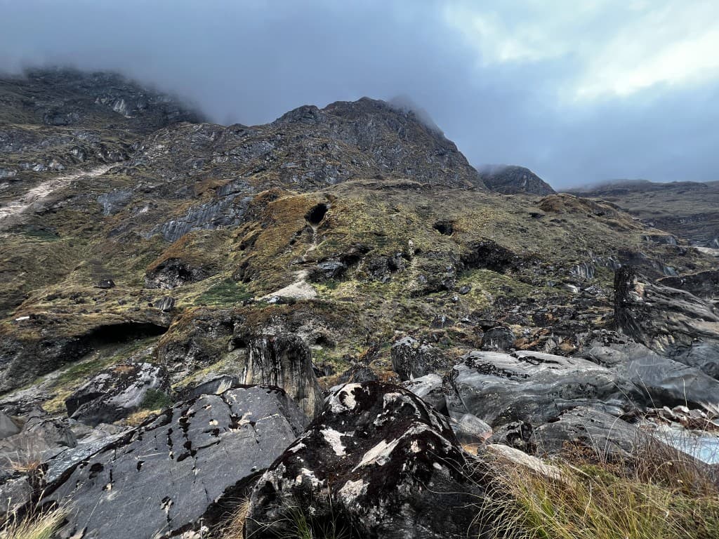 Rugged rocky alpine slopes near Pancha Kunda where camping spots are scarce