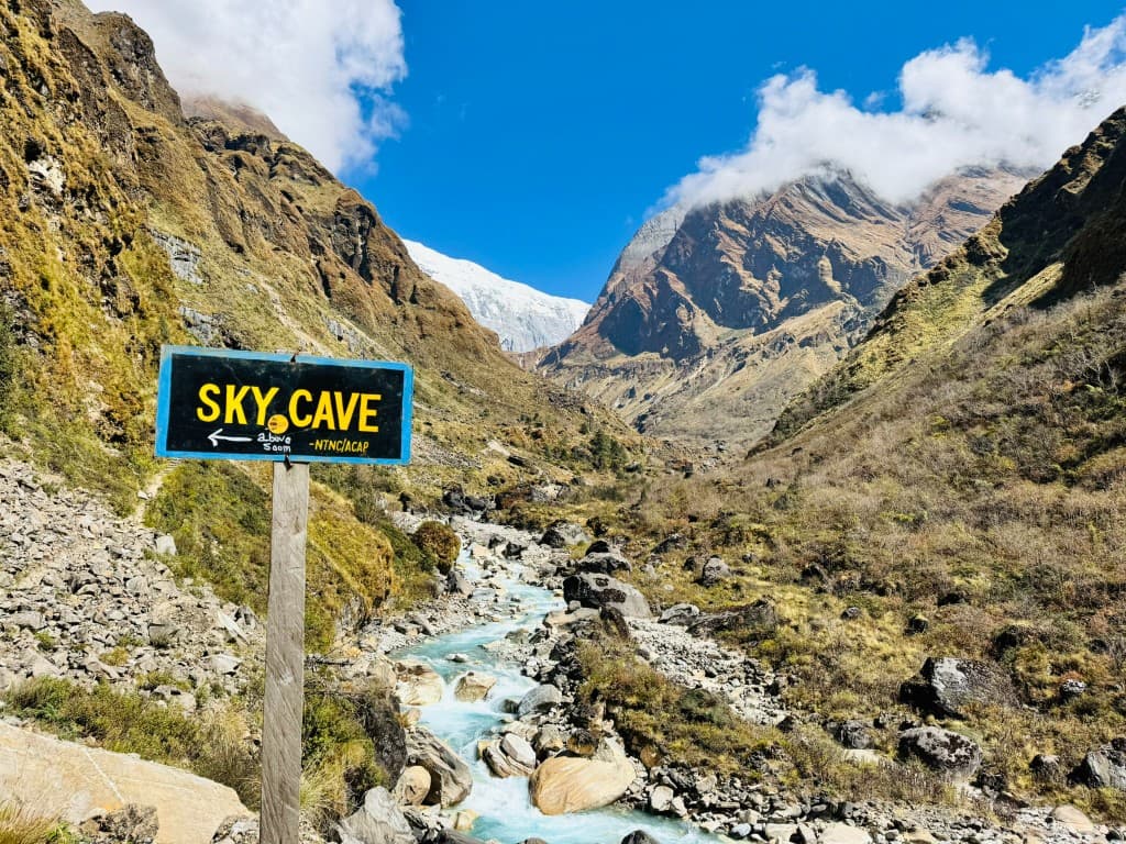 Sky Cave sign above the Miristi Khola river valley on the Maurice Herzog Trail