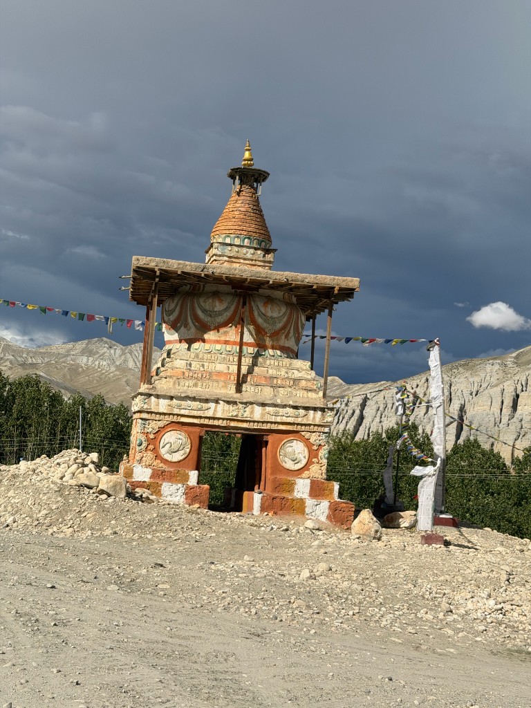 Traditional Buddhist chorten with prayer flags in Upper Mustang
