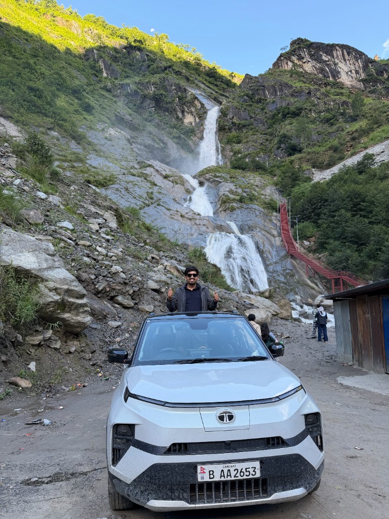 Tata Punch EV stopped at Rupse Waterfall on the Pokhara–Mustang highway