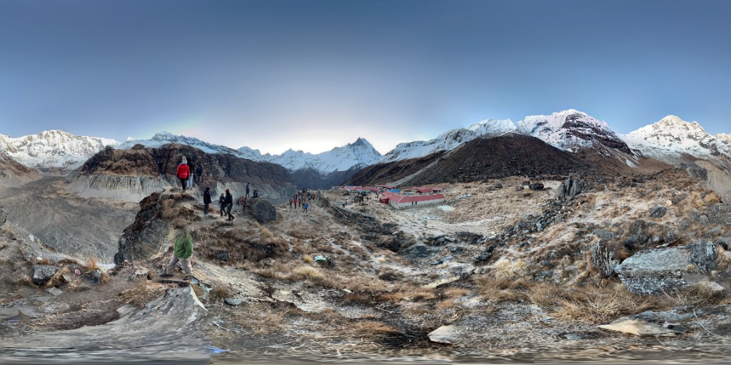 Panorama of Annapurna Base Camp teahouses surrounded by Himalayan peaks