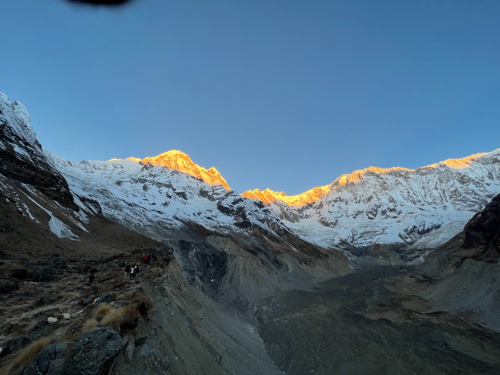 Sunrise light on snow peaks above Annapurna Base Camp