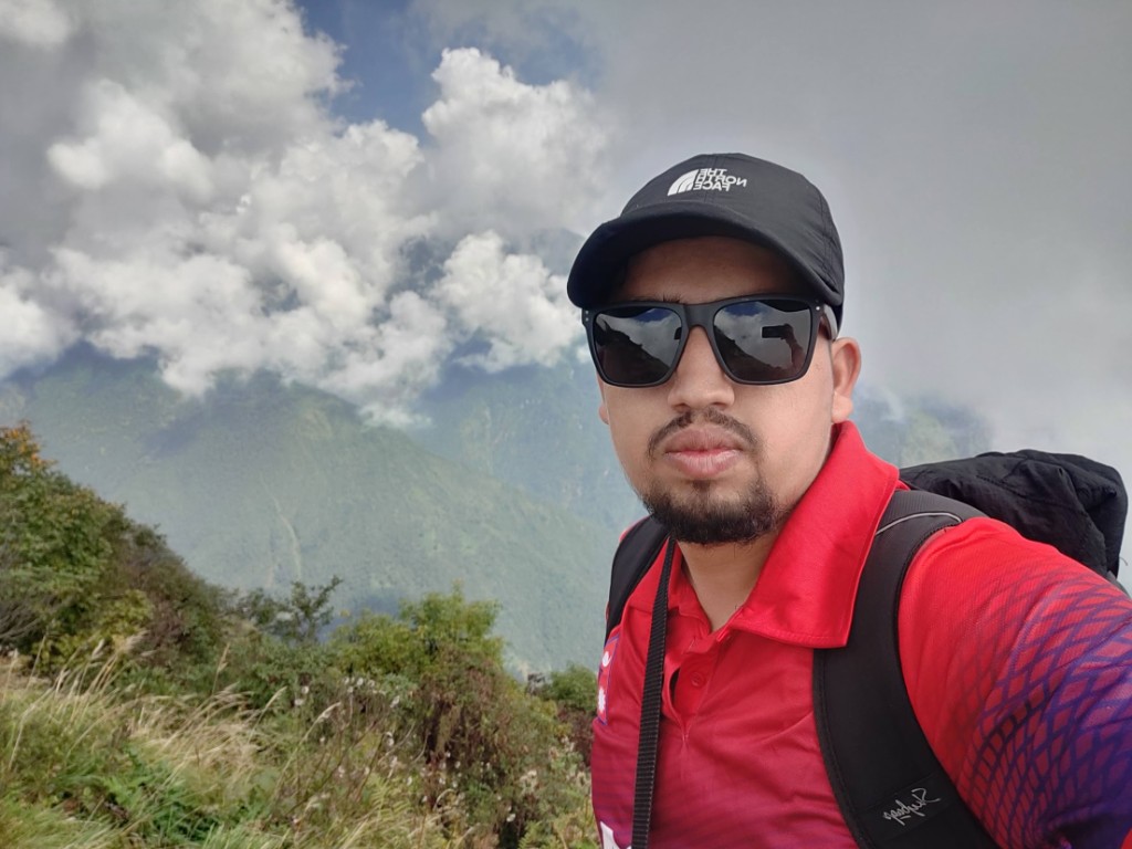 Trekking the Mardi Himal ridge trail with clouds rolling through the Annapurna foothills