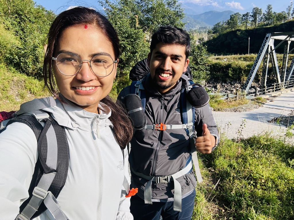 Trekkers starting the journey near a steel bridge toward North ABC