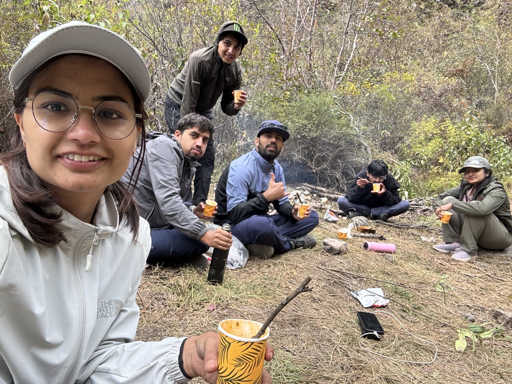 Friends resting with tea and snacks on the North ABC hillside trail