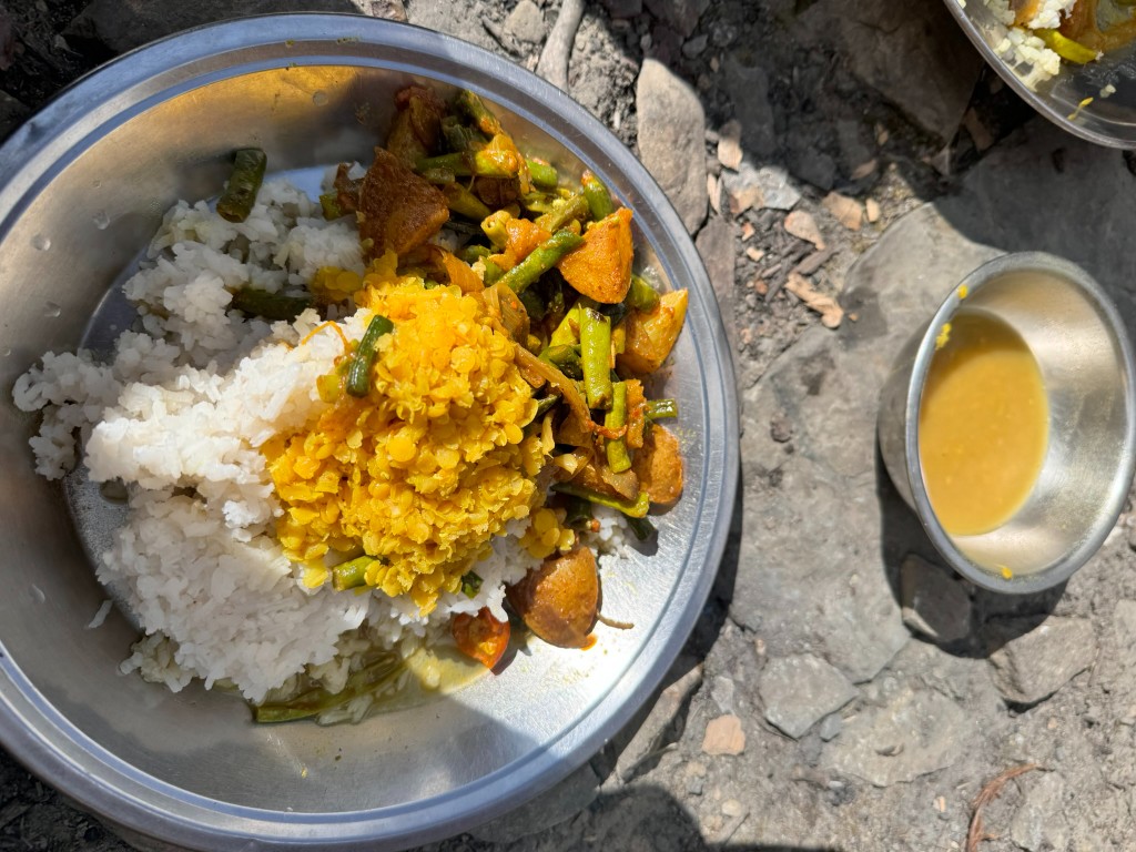 Trail lunch of rice, vegetable curry and dal cooked during North ABC trek