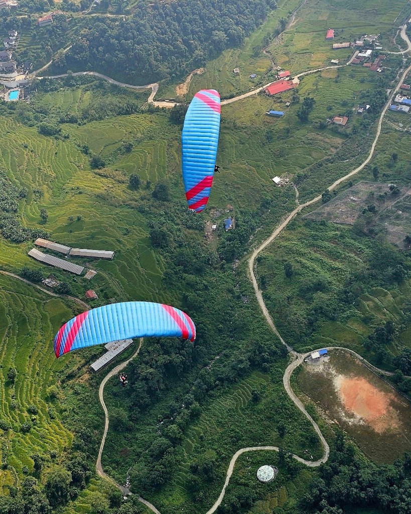 Aerial view of paragliders flying over Pokhara valley